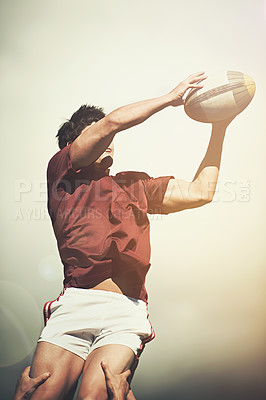 Buy stock photo Rugby, sports and jump and man on field for athlete, health and stadium practice. Challenge, competition and performance with male person in outdoor pitch for exercise, games and workout