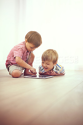 Buy stock photo Tablet, children and siblings on a floor with cartoon, gaming or streaming movie at home. Digital, learning and boy kids in house for google it, search or ebook storytelling, app or Netflix and chill