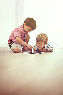 Buy stock photo Kids, tablet and happy siblings on floor for funny cartoon, gaming or movie at home. Digital, learning and boy children in house for google it, search or ebook storytelling, app or Netflix and chill