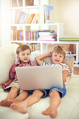 Buy stock photo Laptop, relax and children on sofa in home, learning and family streaming cartoon on internet together. Computer, kids and boys in living room for education, movies or brothers with games in house