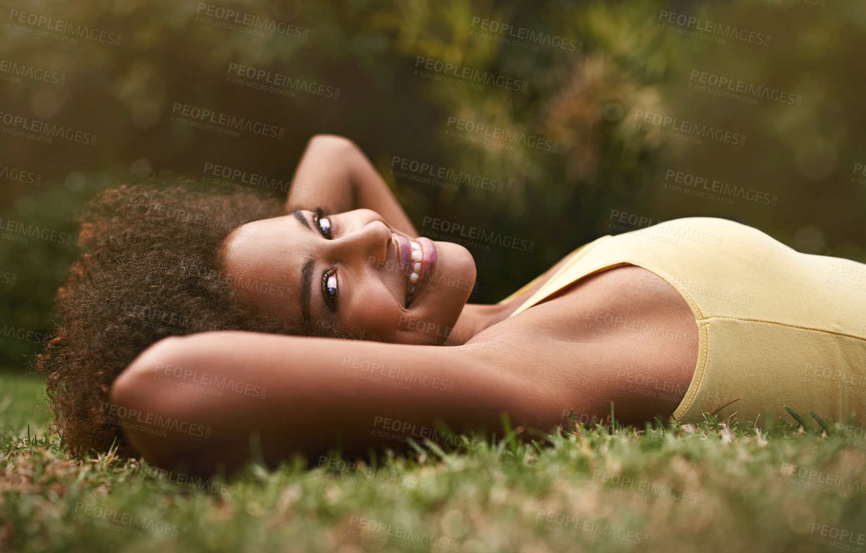 Buy stock photo Happy, grass and portrait of black woman in park for relaxing, calm and peace in nature. Smile, garden and person laying outdoors for holiday, vacation and weekend for wellness, fresh air and joy