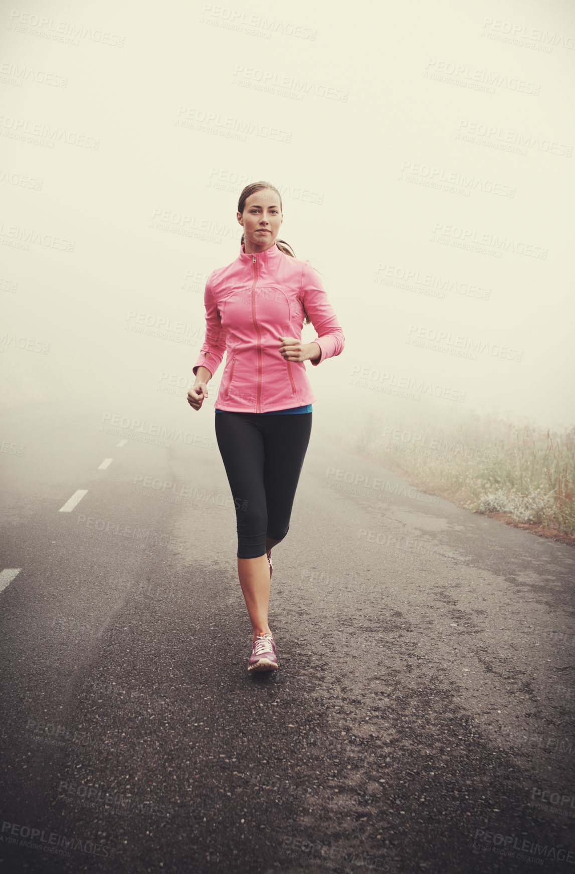 Buy stock photo Nature, fitness and young woman running on mountain road for race, marathon or competition training. Sports, exercise and female athlete with cardio workout in misty outdoor woods or forest.