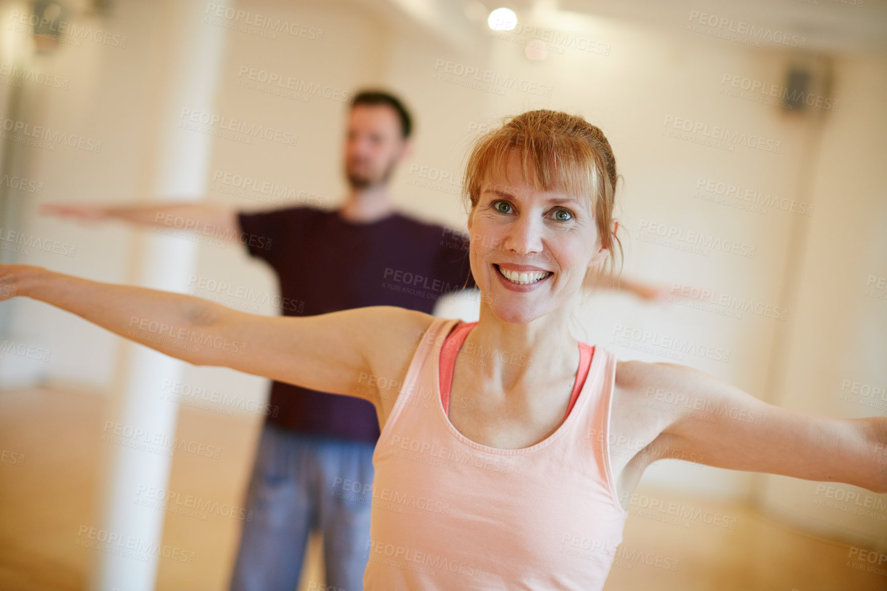 Buy stock photo Shot of two people doing yoga indoors