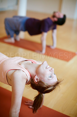 Buy stock photo Cropped shot of a young woman during a yoga class