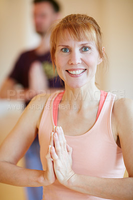 Buy stock photo Shot of a woman doing a yoga class