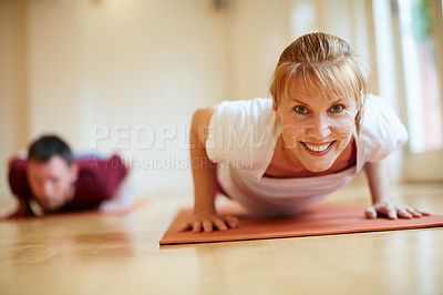 Buy stock photo Shot of a woman doing a yoga class