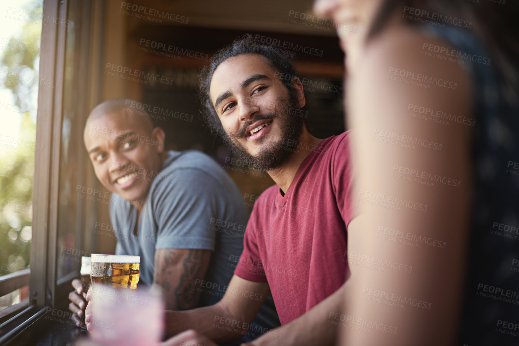 Buy stock photo Friends, people or happiness in pub with beer for happy hour, relax or social event with window view. Diversity, listen or drinking alcohol in restaurant or club with smile for bonding or celebration