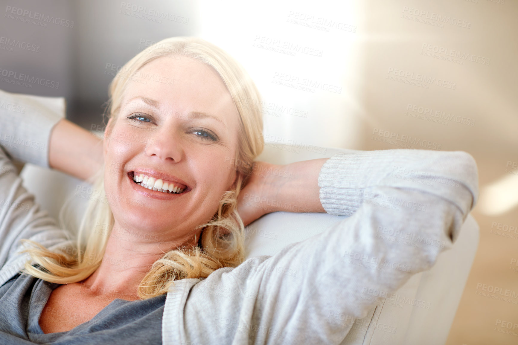 Buy stock photo Portrait of a woman relaxing at home