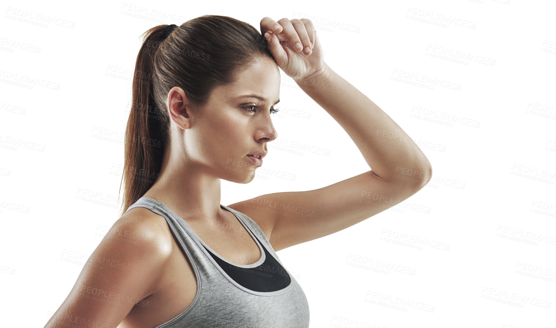 Buy stock photo Cropped shot of a young female athlete wiping the sweat from her brow against white background