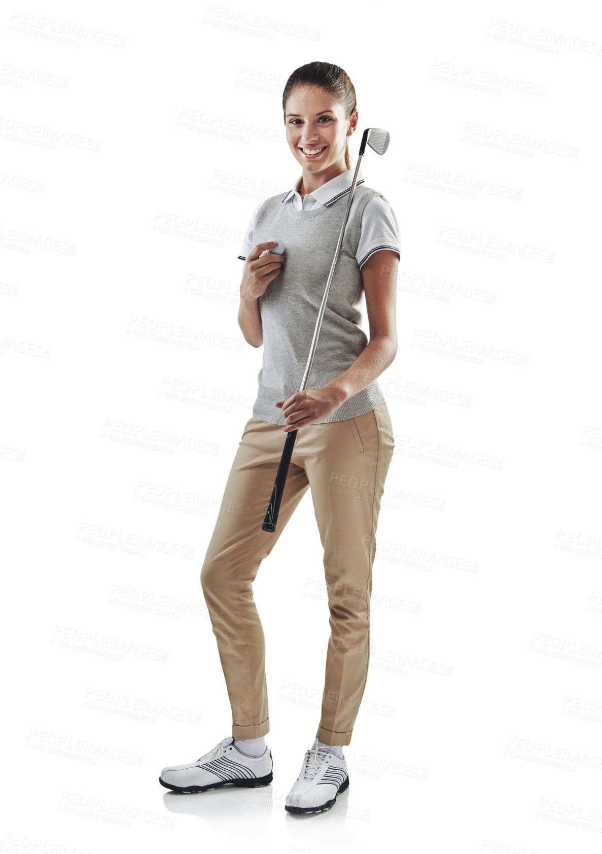Buy stock photo Studio shot of a young golfer holding a golf ball and iron club isolated on white
