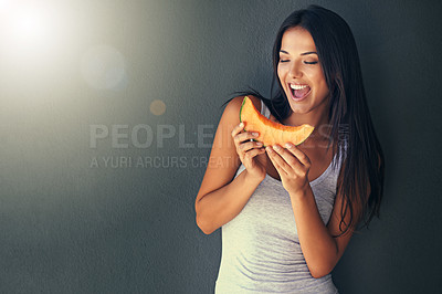 Buy stock photo Slice of melon, happy and woman with nutrition, wellness and lens flare on a grey background. Person, mockup space and model with a fruit and excited with diet plan and healthy living with vegetarian