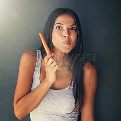 Buy stock photo Portrait, woman or eating carrot for healthy food in studio for vegan diet, meal or vegetables for lunch. Grey background, snack or vegetarian person with fresh, natural vitamins or organic produce