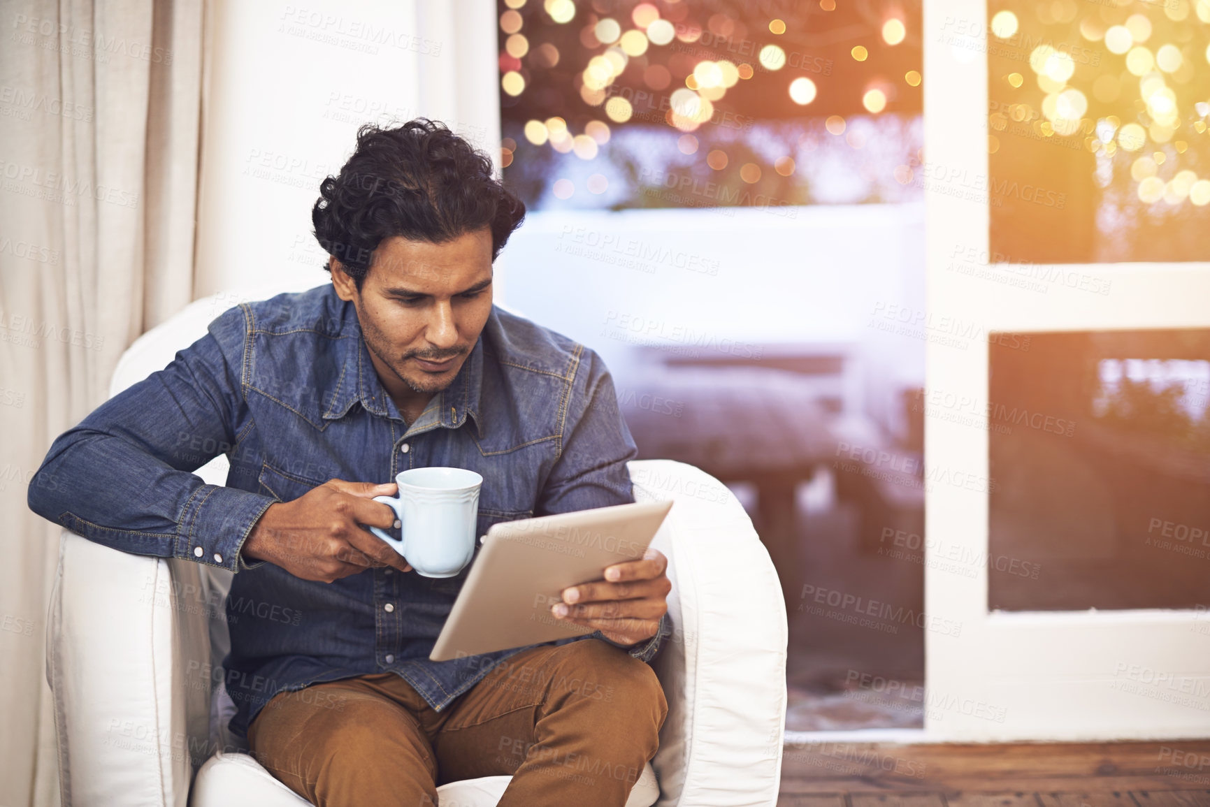 Buy stock photo Tablet, coffee and man on sofa in living room for online blog on social media, app or internet. Reading, web and male person drinking cappuccino and scroll on digital technology in lounge at home.