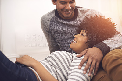 Buy stock photo Couple, holding and relax for care and talk in home, smile and proud of marriage and commitment. Happy people, conversation and cozy on floor in lounge on weekend, support and trust in relationship
