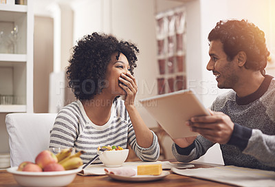 Buy stock photo Love, breakfast and couple with a tablet, funny and happiness with joy, relax and bonding at home. Partners, man and happy woman in the kitchen, technology and loving with communication and laughing