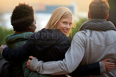 Buy stock photo College, friends and portrait with hug outdoor for bonding, relax and break on campus with diversity. University, people and smile with embrace for support, education and learning fun with rear view