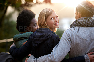 Buy stock photo University, friends and portrait with hug or happy for bonding, relax and break on campus with diversity. College, people and smile with embrace for support, education and learning fun with rear view