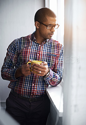 Buy stock photo Business man taking a break while looking out of the window. African American male relaxing indoors by viewing outside urban activity. Office worker watching city life below the building.