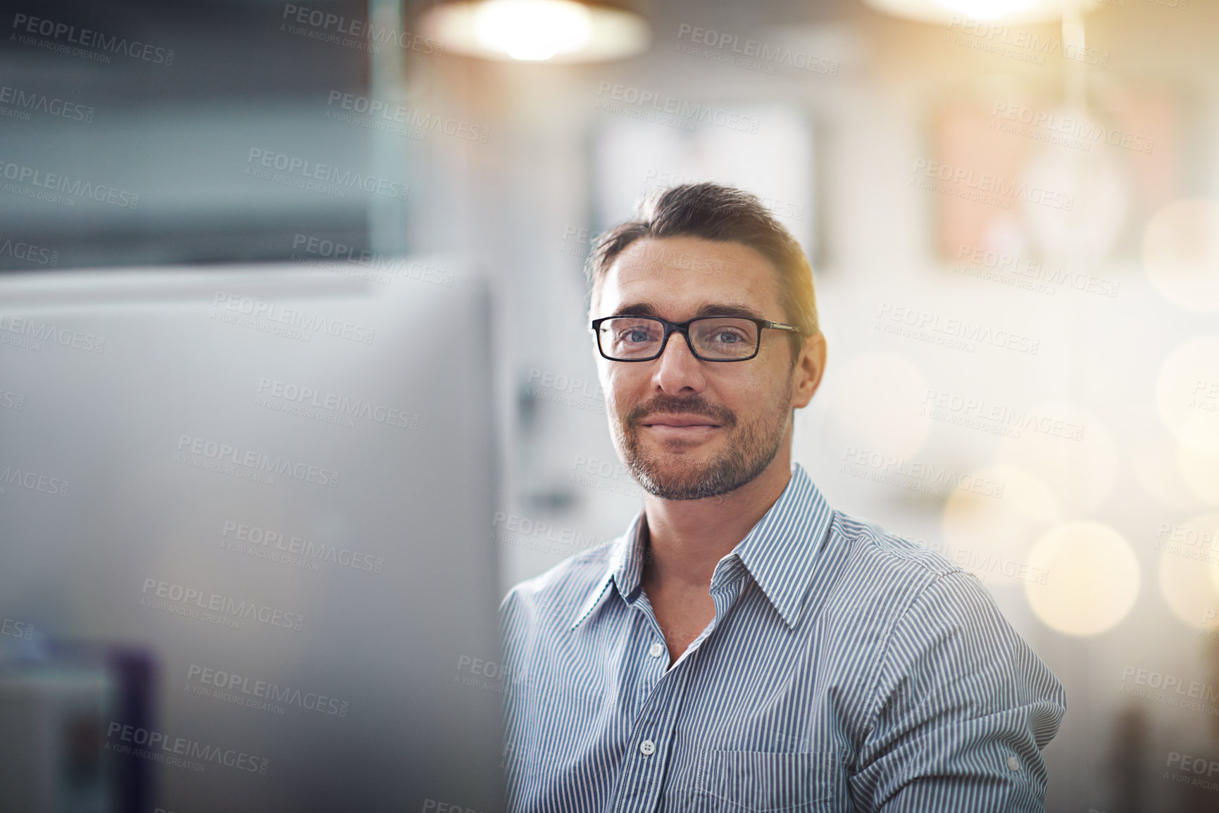 Buy stock photo Portrait of a businessman working at his desk
