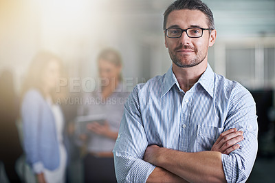 Buy stock photo Portrait of a business with his colleagues blurred in the background