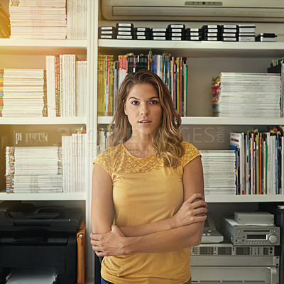 Buy stock photo Portrait of a woman standing in front of bookshelves in her home office