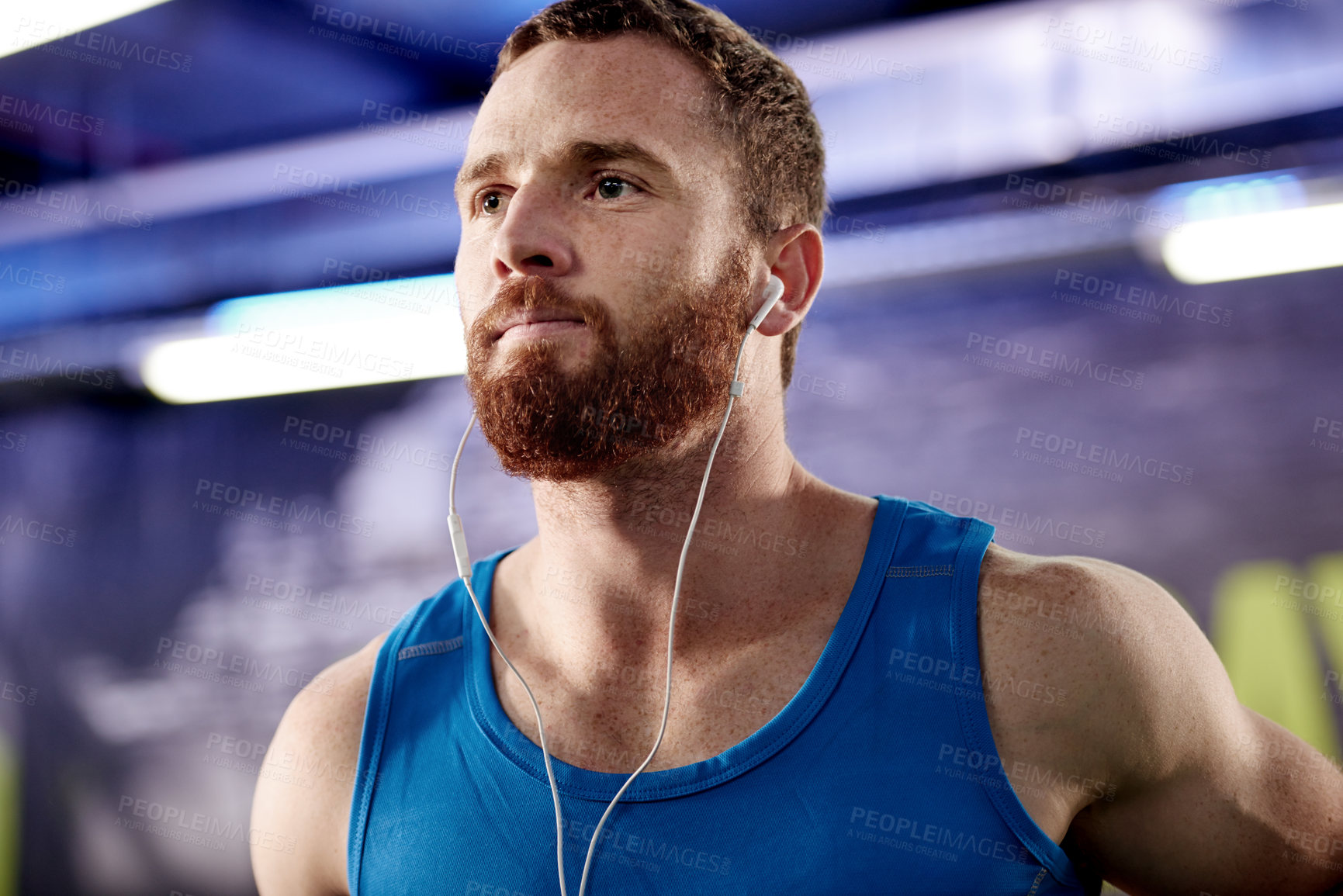 Buy stock photo Earphones, sports and man athlete in gym for strength, body and weight loss workout for health. Wellness, exercise and male person listening to music, radio or podcast for training in fitness center.