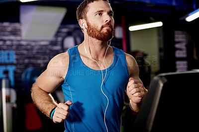 Buy stock photo Earphones, exercise and man running on treadmill in gym for health, wellness and body weightloss. Fitness, runner and male athlete with cardio workout on machine for race training in sports center.