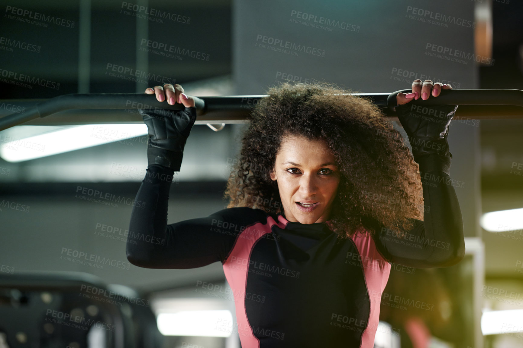 Buy stock photo Portrait, woman and pull up exercise at gym on bar for muscle, wellness or healthy body. Chin up, fitness and strong person with equipment at club for power, training and workout with face in Brazil