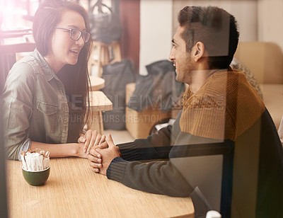 Buy stock photo Happy couple, relax and talking with date at cafe for conversation or enjoying romance at indoor restaurant. Young man and woman by window at coffee shop for social, chatting or bonding together