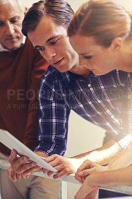 Buy stock photo Professional employees, tablet and teamwork at office for research, social media or online communication. Business people, technology and meeting for work feedback, reading email or idea for job