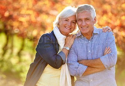 Buy stock photo Cropped shot of a senior couple standing outdoors on a wine farm