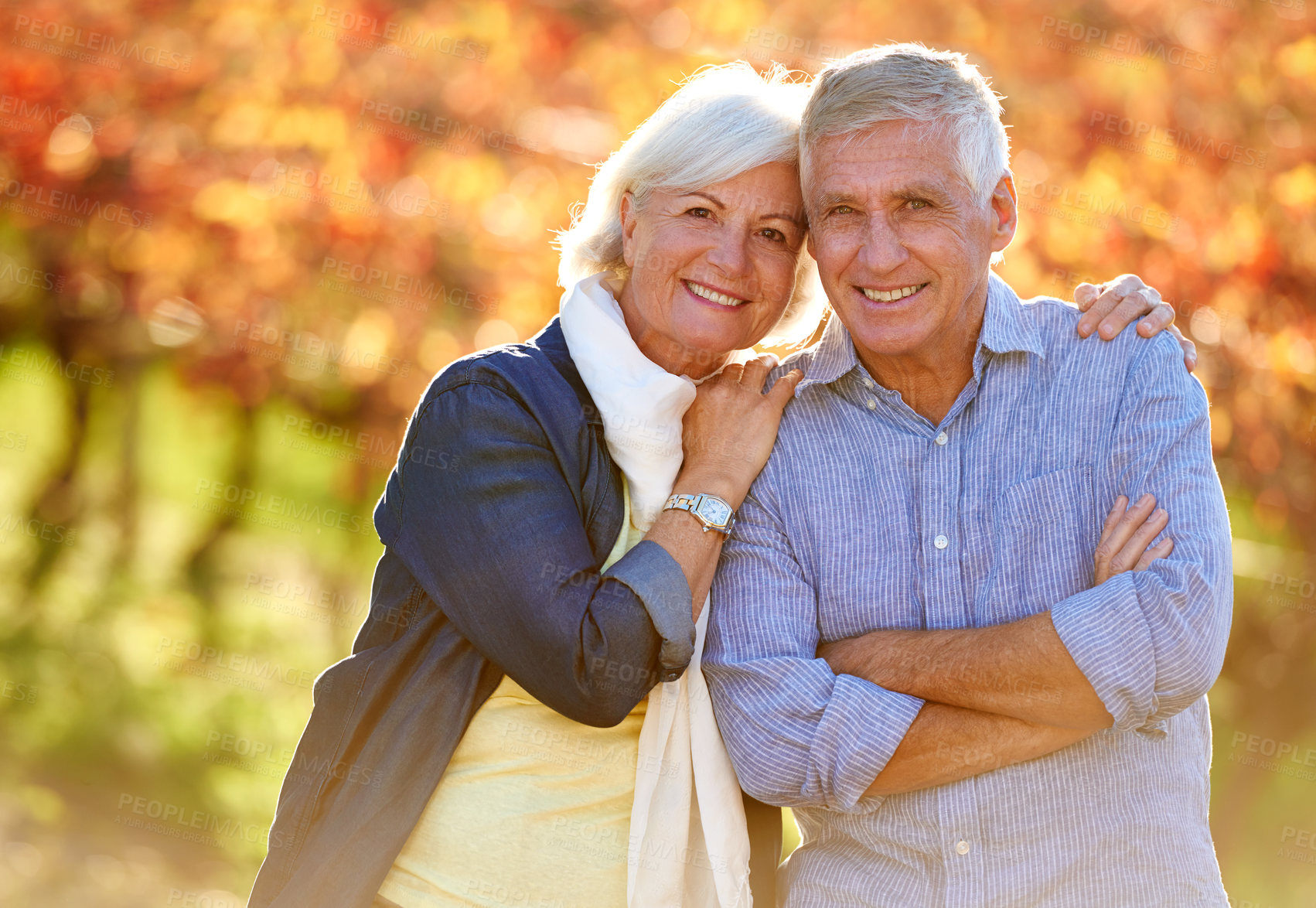 Buy stock photo Cropped shot of a senior couple standing outdoors on a wine farm