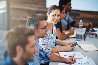 Buy stock photo Portrait of a young businesswoman in a seminar with her colleagues