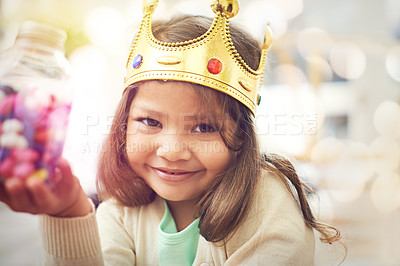 Buy stock photo Candy, girl or princess with crown in portrait, home or castle with queen costume, sweets or royal tiara. Play, happiness or face of a child or kid with smile, development or fantasy game in a house