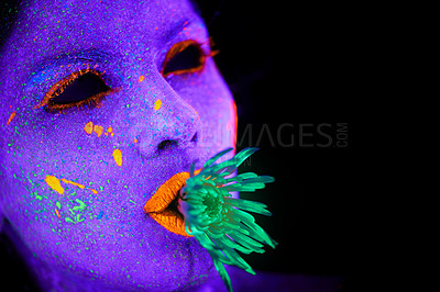 Buy stock photo Neon, paint and face of woman with art in studio or plant for organic creativity, psychedelic aesthetic or mockup space. Glow makeup, person or fluorescent glitter for uv illusion on black background