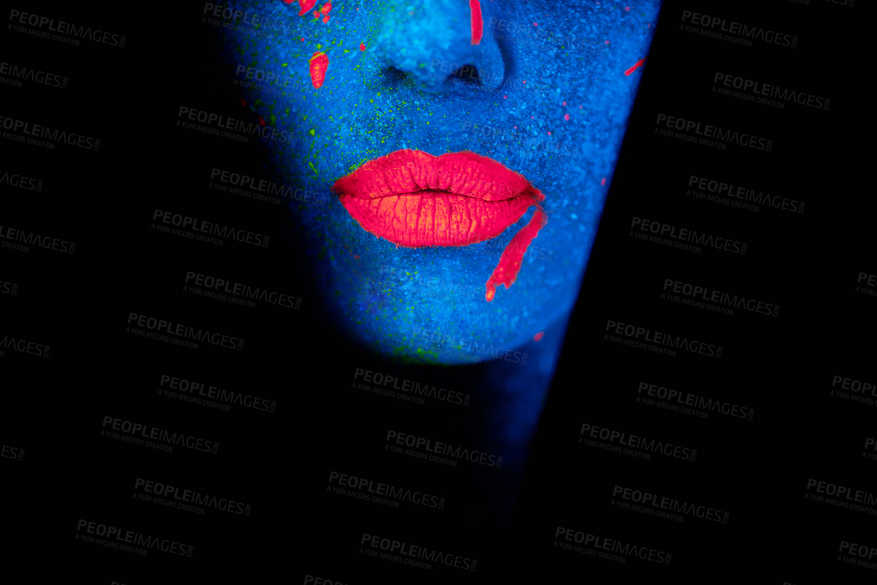 Buy stock photo Shot of a young woman posing with neon paint on her face