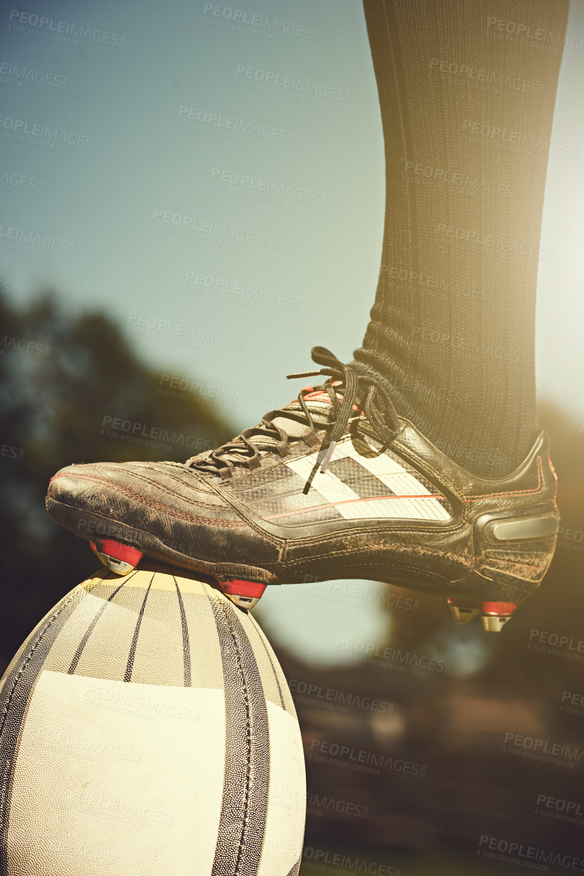 Buy stock photo Rugby man, feet and sports ball outdoor on a pitch for action, goal or score. Male athlete closeup of shoes playing in sport competition, game or start training for fitness, workout or exercise 