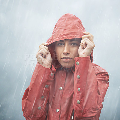 Buy stock photo Woman, protection and portrait with rain, coat and clouds with safety in nature. Girll, face and storm with cloudy, winter and waterproof hat for confidence and weather with adventure or vacation