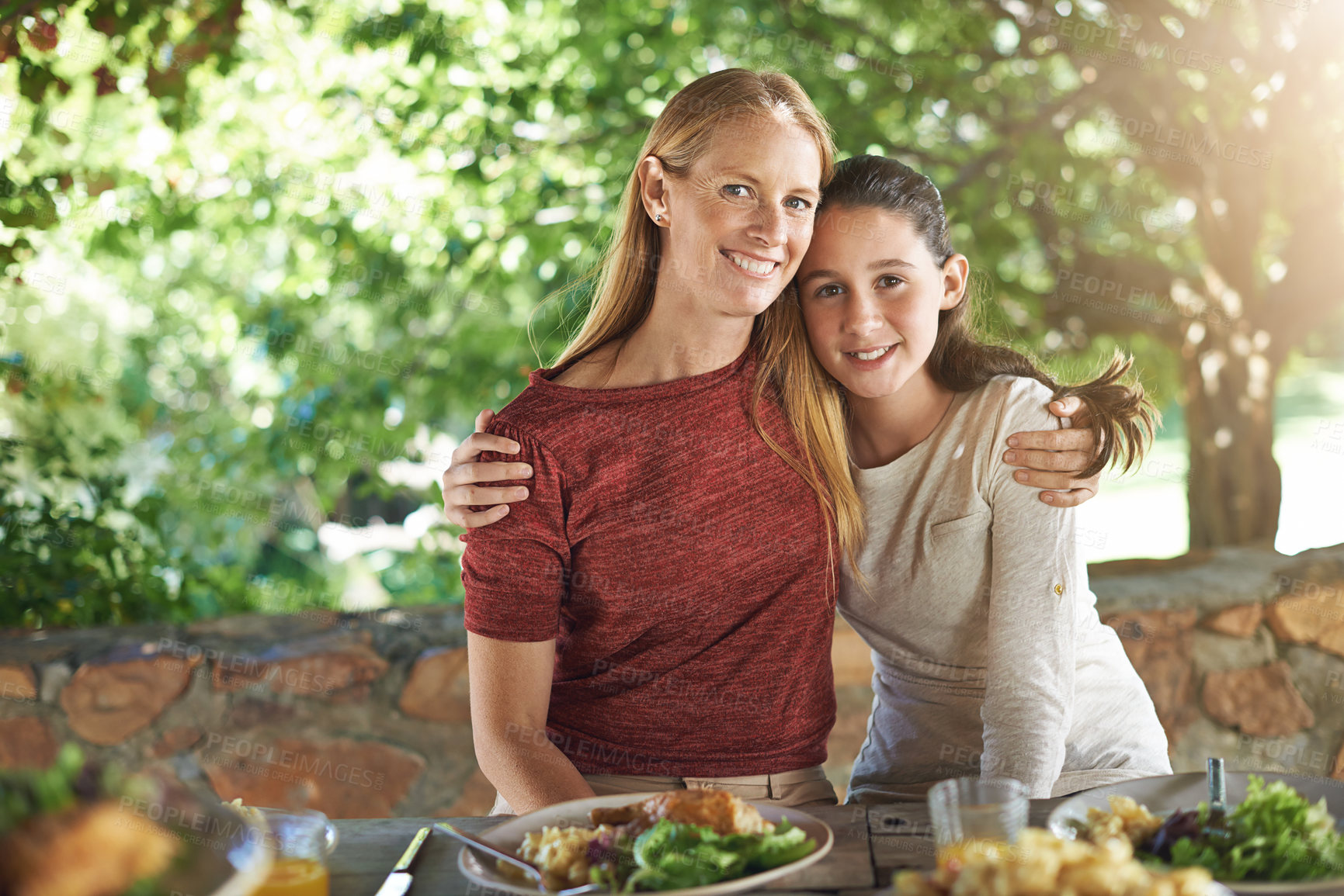 Buy stock photo Portrait, hug and food with mother, girl and happiness with healthy meal and social gathering with nature. Face, embrace and family with parent and mama with daughter and child with lunch and smile