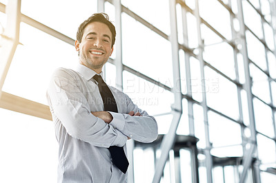 Buy stock photo Cropped portrait of a businessman standing in the lobby