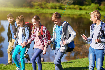 Buy stock photo Group of children and fishing outdoor at lake in nature for fun or hobby at summer camp. Happy, friends and walking to play with gear for water activity on holiday for outside recreation adventure