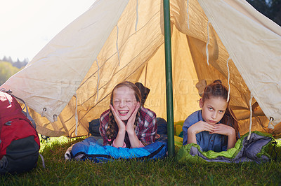 Buy stock photo Kids, gen z and camping in tent in nature for holiday, adventure and sleeping in woods for vacation. Portrait, happiness and friends on field trip for school, children and bootcamp for girls.