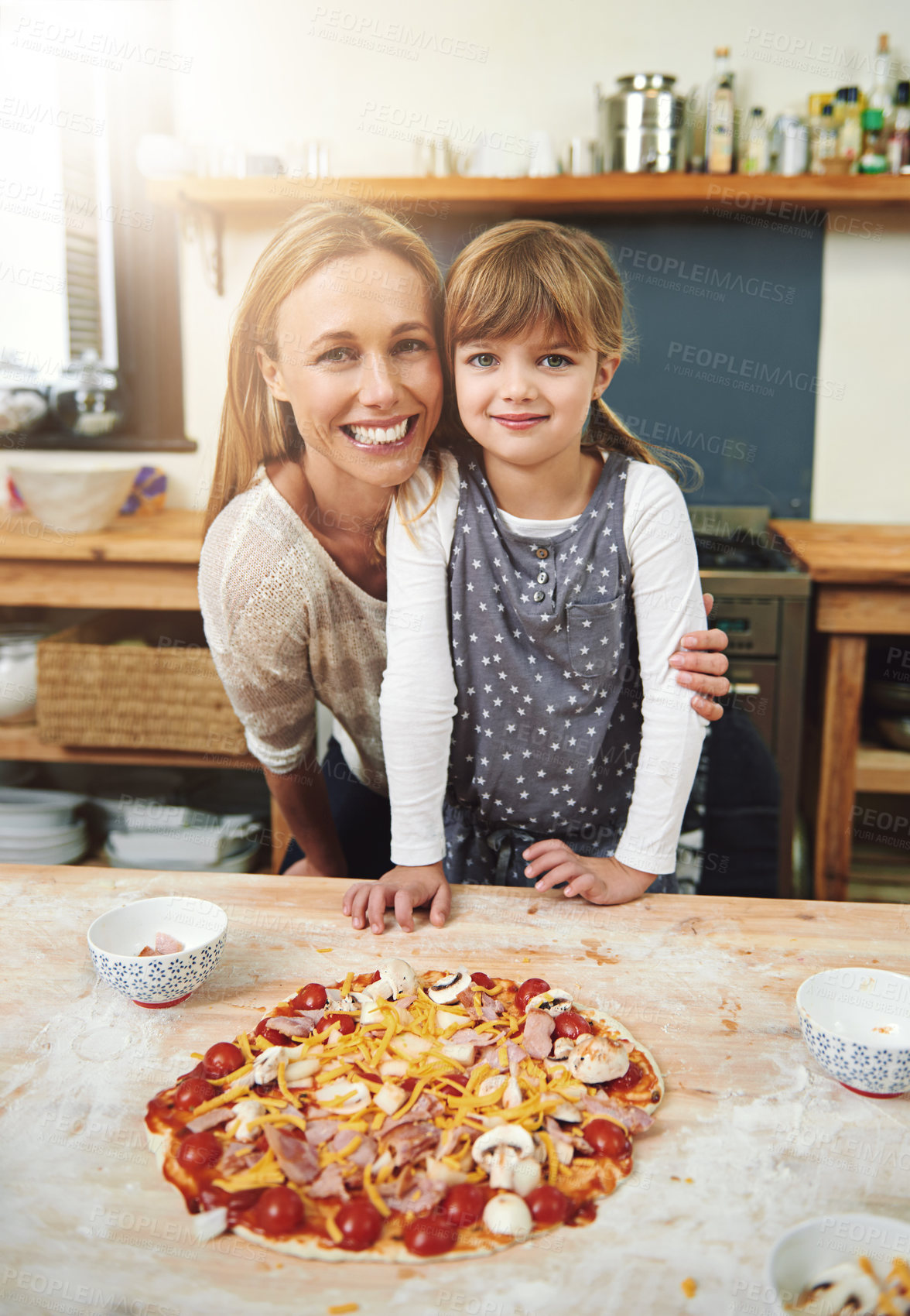 Buy stock photo Woman, girl child and cooking pizza with smile in portrait with hug in kitchen for learning, help and development. Food, mother and daughter with dough, teaching and happy for bonding in family home