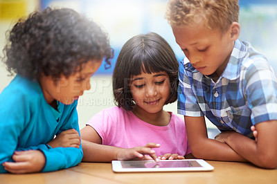 Buy stock photo Happy children, tablet and students in classroom for elearning, education or online lesson at school. Young group of elementary kids smile on technology for games, entertainment or virtual class