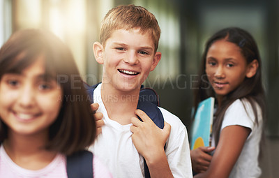 Buy stock photo Portrait of elementary students standing in a school hallway