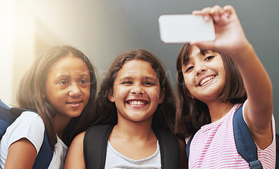 Buy stock photo Friends, children and smile for selfie in elementary school, educational memory and learning together. Diversity, young students and group of girls taking picture for social media, photography or fun