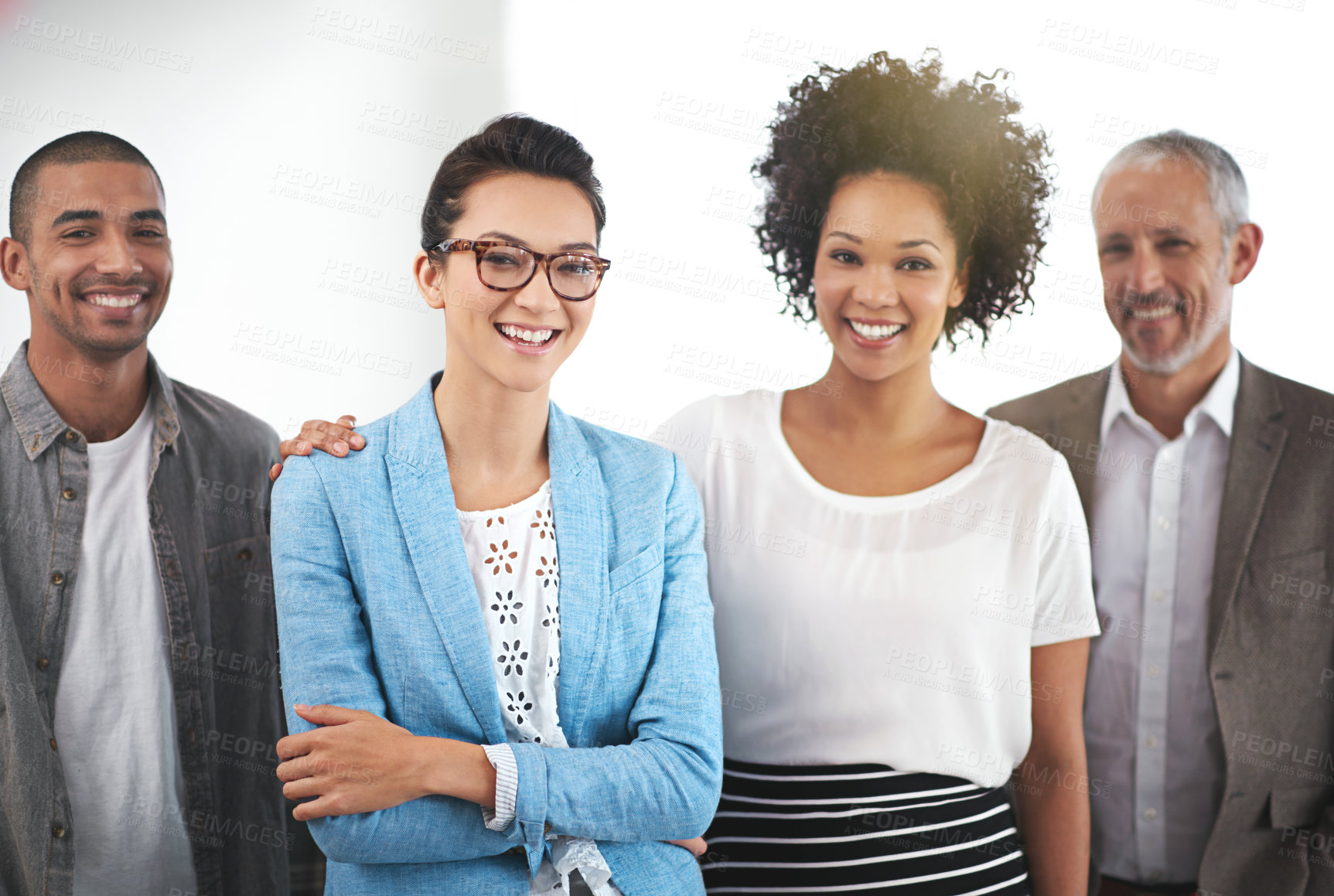 Buy stock photo Portrait of a group of positive coworkers standing in an office