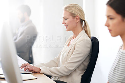 Buy stock photo A businesswoman working at her office computer
