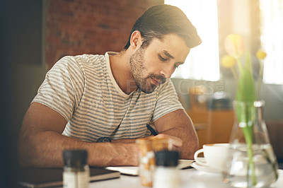 Buy stock photo Man, coffee shop and freelancer for writing notes, inspiration and writer for creativity in restaurant. Male person, journal and plan for story or author, calm and peace in cafe for script project