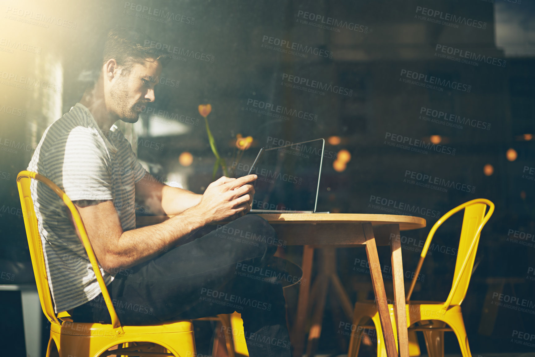 Buy stock photo Man, laptop and relax with phone at cafe for social media, communication or networking at indoor restaurant. Male person sitting on mobile smartphone for online chatting or texting at coffee shop